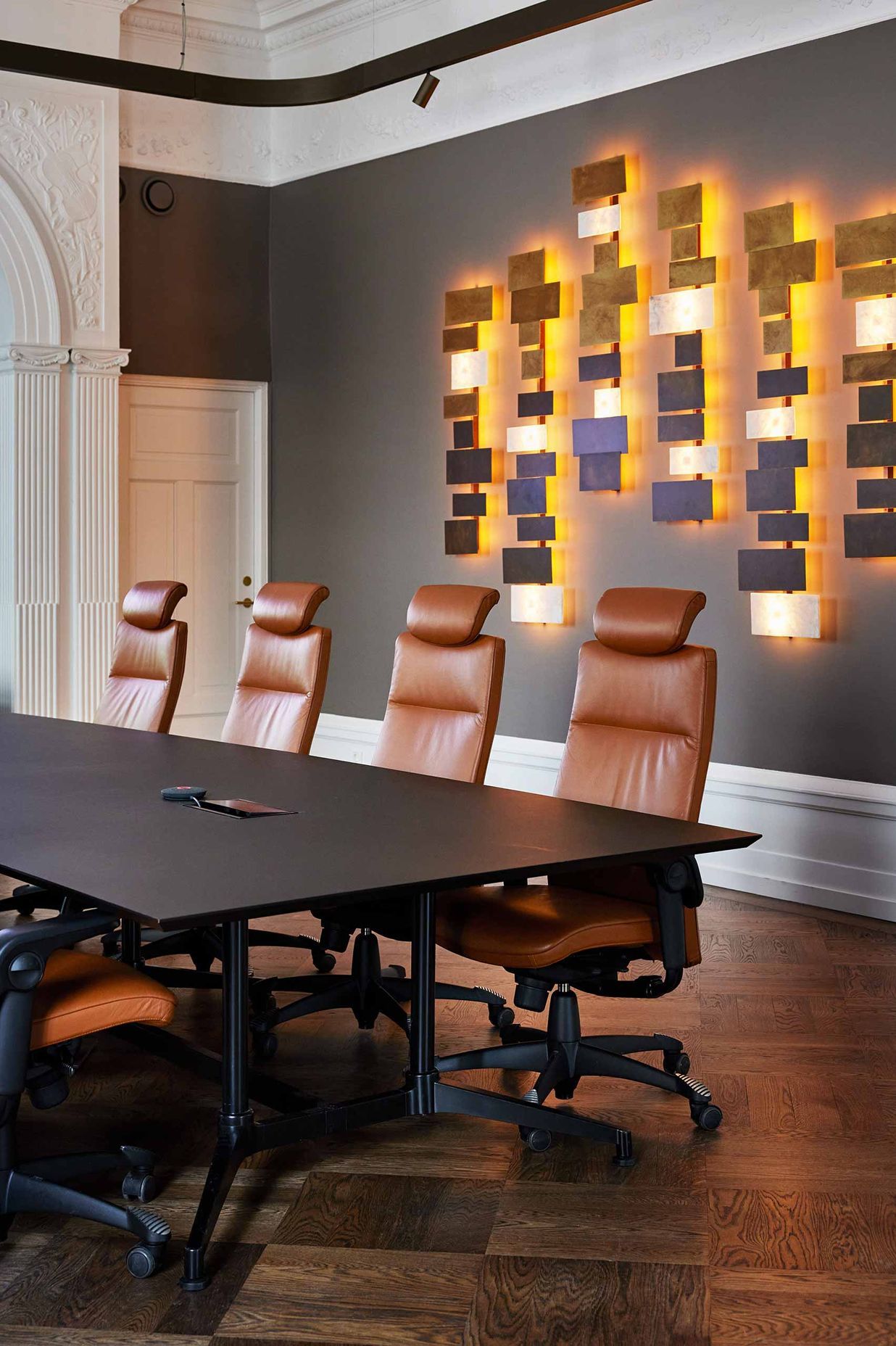 Ergonomic HÅG Tribute seating and warm lighting provides a welcoming environment to Oslo's Forte boardroom.