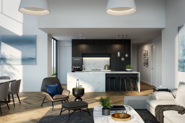 Bright open-plan contemporary kitchen and living area with a central marble-look island, dark timber cabinetry, integrated appliances, pendant lighting, timber flooring, and a neutral lounge setting. Large windows bring in natural light, while a dining table and artwork are visible at the left.