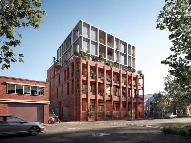 Architectural rendering of a contemporary multi-storey urban apartment or mixed-use building, combining a landscaped red-brick podium with a lighter framed upper level. The street-facing facade features deep vertical window bays, projecting brick piers, balconies or planted terraces, and a clean rectilinear composition. Adjacent brick buildings and mature street trees establish an urban suburban context.