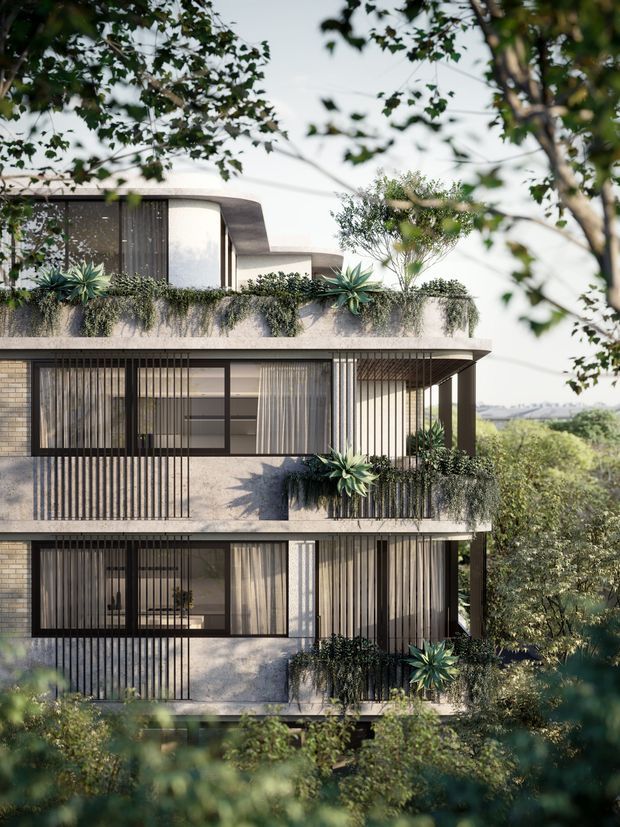 A contemporary multi-storey residential building viewed through surrounding trees. The facade combines pale textured masonry, extensive floor-to-ceiling glazing, dark vertical screens and slender metal balustrades, with layered balconies planted with trailing greenery and sculptural succulents. Curved roof and balcony edges soften the rectilinear form, while a distant landscaped landscape is visible beyond.