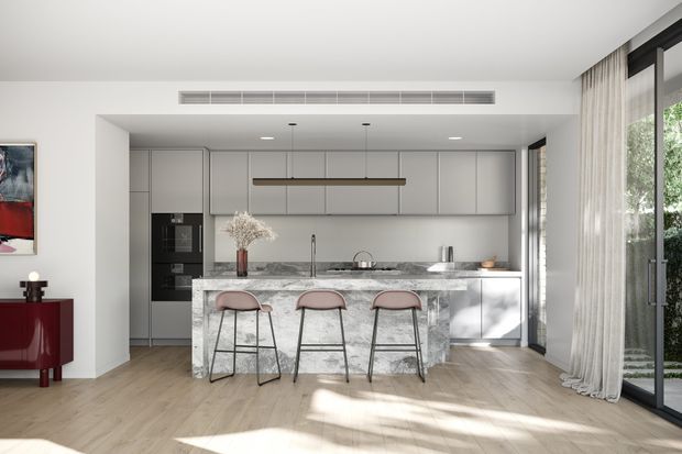 Bright contemporary open-plan kitchen with a large marble-look island, three bar stools, integrated grey cabinetry, black appliances, and full-height glazed doors with sheer curtains opening toward greenery. Light timber flooring and minimalist linear lighting create an airy, refined interior.