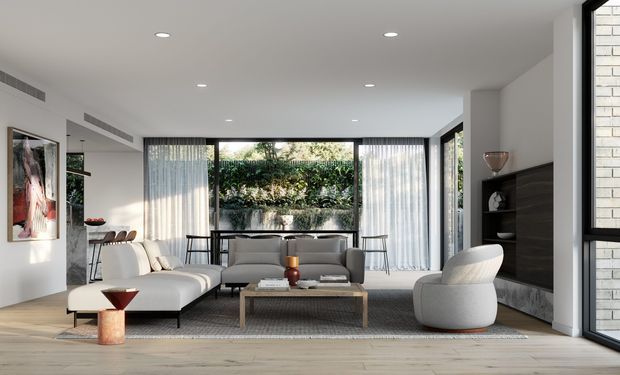 A bright contemporary living room with a large pale sectional sofa, grey lounge sofa, rounded armchair, low timber coffee table, dark built-in media cabinetry, and floor-to-ceiling black-framed glazing. Sheer curtains open the room to a planted outdoor courtyard, while recessed ceiling lights and light timber flooring create an airy, refined interior.