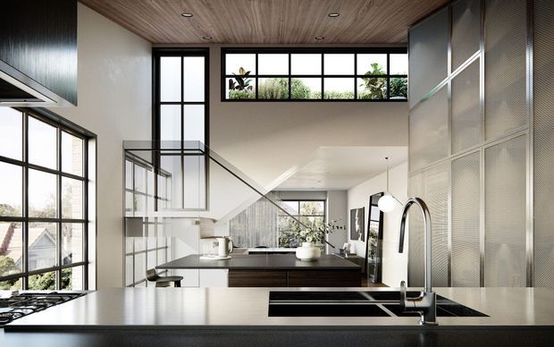 Contemporary open-plan kitchen viewed from the island, featuring a dark stone benchtop, integrated cooktop and sink, dark timber cabinetry, black-framed industrial-style glazing, a timber-lined ceiling, and a perforated metal feature wall. The kitchen opens toward a bright double-height living area with a glass balustrade and abundant natural light.