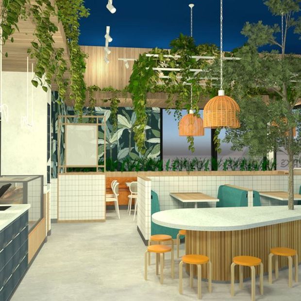 A bright contemporary café or hospitality interior with a curved, tiled central counter and rounded pale benchtop surrounded by orange stools. Teal upholstered booth seating, small timber tables, pale tiled partitions, timber wall cladding, hanging woven pendant lights, abundant greenery, and botanical artwork create a lively biophilic atmosphere.