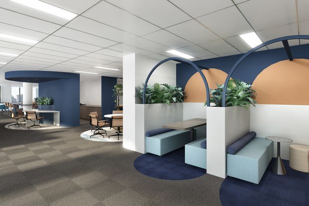 A contemporary commercial office interior with open-plan work and breakout areas. The space features curved navy-blue partition walls and arched metal frames, integrated planter boxes with lush greenery, built-in upholstered booth seating in pale blue, timber tables, and a neutral patterned carpet. White acoustic ceiling tiles and bright linear lighting create a clean, professional workplace atmosphere, with warm peach wall panels adding contrast.
