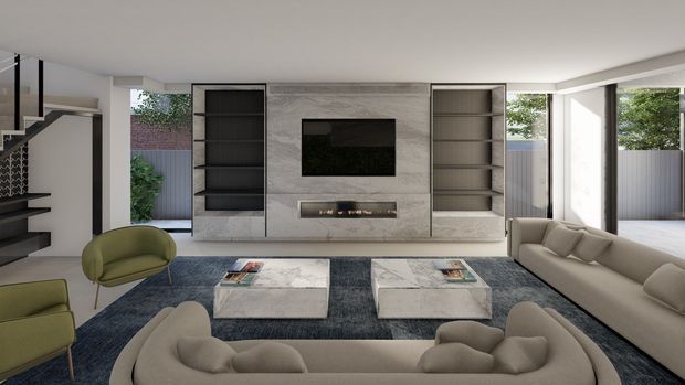 A bright contemporary living room viewed toward a textured stone feature wall with a wall-mounted television, linear fireplace, and symmetrical dark built-in shelving. A large neutral sectional sofa, green accent chairs, marble-look coffee tables, and a deep blue rug furnish the open-plan space. Floor-to-ceiling glazing at the right opens toward an outdoor area, while a staircase is partially visible at the left.