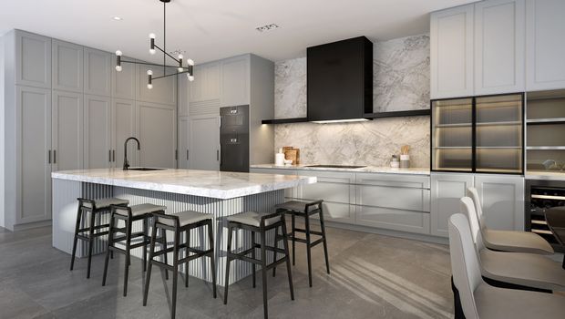 Contemporary kitchen with a large marble-look island, integrated seating for multiple people, grey built-in cabinetry, a black rangehood, illuminated splashback, and a dining area visible at right. The space uses a restrained grey, white, black, and metallic palette with pendant lighting and polished modern detailing.