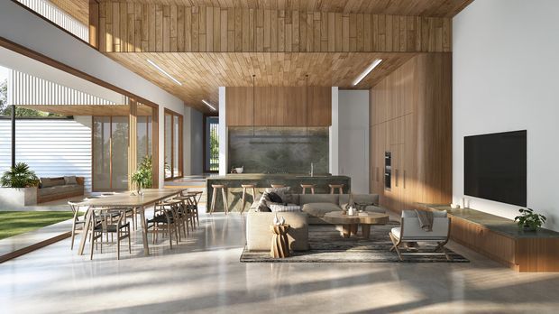 A spacious open-plan contemporary interior combining a dining area, kitchen and living room. The space features extensive timber wall and ceiling lining, full-height glazing, a long kitchen island with stools, a dining table, and a living area with a low sofa, armchairs and wall-mounted television. Natural light creates a warm, refined atmosphere, with a view toward a landscaped courtyard through the glazing.