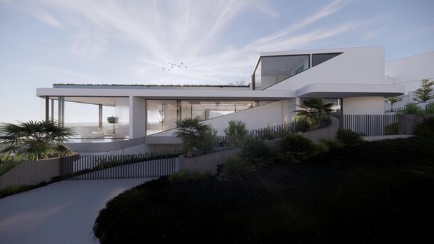 Contemporary white multi-level residence with strong horizontal rooflines, expansive floor-to-ceiling glazing, a curved upper-level form, and a flat or subtly planted roof edge. The house is set on a landscaped sloping site with a curved driveway and sculptural coastal-style planting. Soft daylight and pale finishes create a clean, airy presentation.