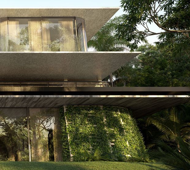 Exterior architectural photograph of a modern, multi-level building integrated into lush tropical landscaping. The structure features broad projecting flat roof slabs, extensive floor-to-ceiling glazing, slender dark frames, textured concrete or plaster soffits, and a prominent vertical living wall covered in dense greenery. Palm trees and other foliage surround the building, creating a strong indoor-outdoor relationship.