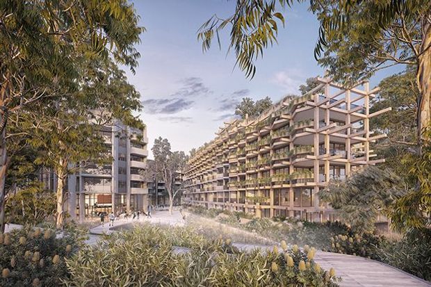 Architectural visualization of a large contemporary multi-storey residential or mixed-use development integrated into a landscaped setting. The complex features extensive repetitive balconies, exposed structural framing, warm timber-toned or concrete elements, and abundant native-looking planting. Pedestrian paths and mature trees surround the buildings, with a smaller adjoining block visible on the left.