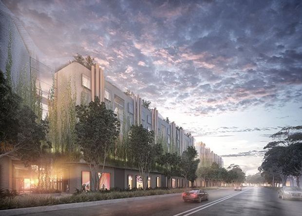 Architectural visualization of a long contemporary multi-storey urban building lining a broad tree-lined street at dusk. The facade combines pale vertical panels, projecting fins, extensive glazing, and a darker active ground level with illuminated openings. A fine mesh or louvred screen curves along the upper left edge, while landscaping softens the streetscape and cars travel along the road.