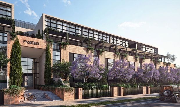 Architectural rendering of a contemporary multi-storey residential or mixed-use development with a long, articulated facade. The building combines warm brick and pale masonry cladding with extensive dark-framed glazing, projecting upper-level volumes, planted balconies, climbing greenery, and a landscaped street frontage. A recessed entrance is marked “PORTER,” with pedestrian paving, bicycles, street trees, and a parked vehicle visible in the foreground.