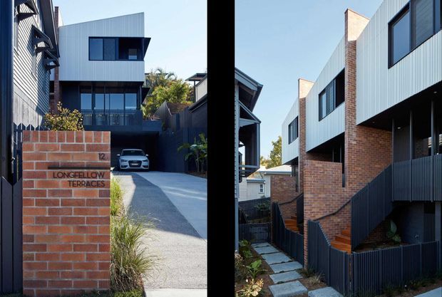 Composite exterior architectural photograph showing a contemporary multi-unit residential development with two-storey forms. The buildings combine red brick masonry, pale corrugated metal cladding, dark metal fencing and window frames, projecting upper-level volumes, balconies, and pitched roof elements. One view includes a sloping driveway and numbered brick entry wall; the other shows a landscaped pedestrian path and external stairway between buildings.