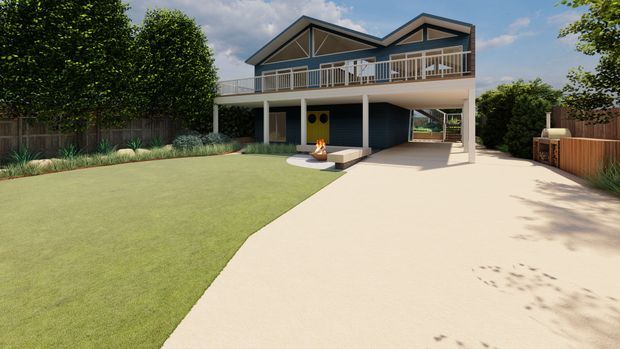 A contemporary raised two-storey house viewed from the landscaped front yard. The home has dark horizontal cladding, prominent angular gabled roof forms, extensive upper-level balcony railings, and an open ground-level carport or covered outdoor area. A broad pale driveway curves through a neatly landscaped lawn, with timber fencing and established planting around the site.