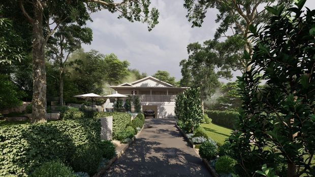 A landscaped residential property viewed from the street, with a paved driveway leading through manicured hedges and gardens to a single-storey house. The home has a light rendered facade, a prominent pitched gable roof, covered entry, and a carport or garage area, surrounded by mature trees and dense planting.