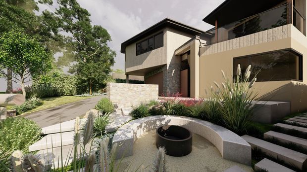 Contemporary multi-level residential home viewed from a landscaped front garden. The facade combines warm beige rendered walls, dark framed glazing, textured stone cladding, projecting upper-level forms and a dark flat roof. Curved concrete garden seating and a circular fire feature sit among ornamental grasses, paved paths and stepped landscaping.