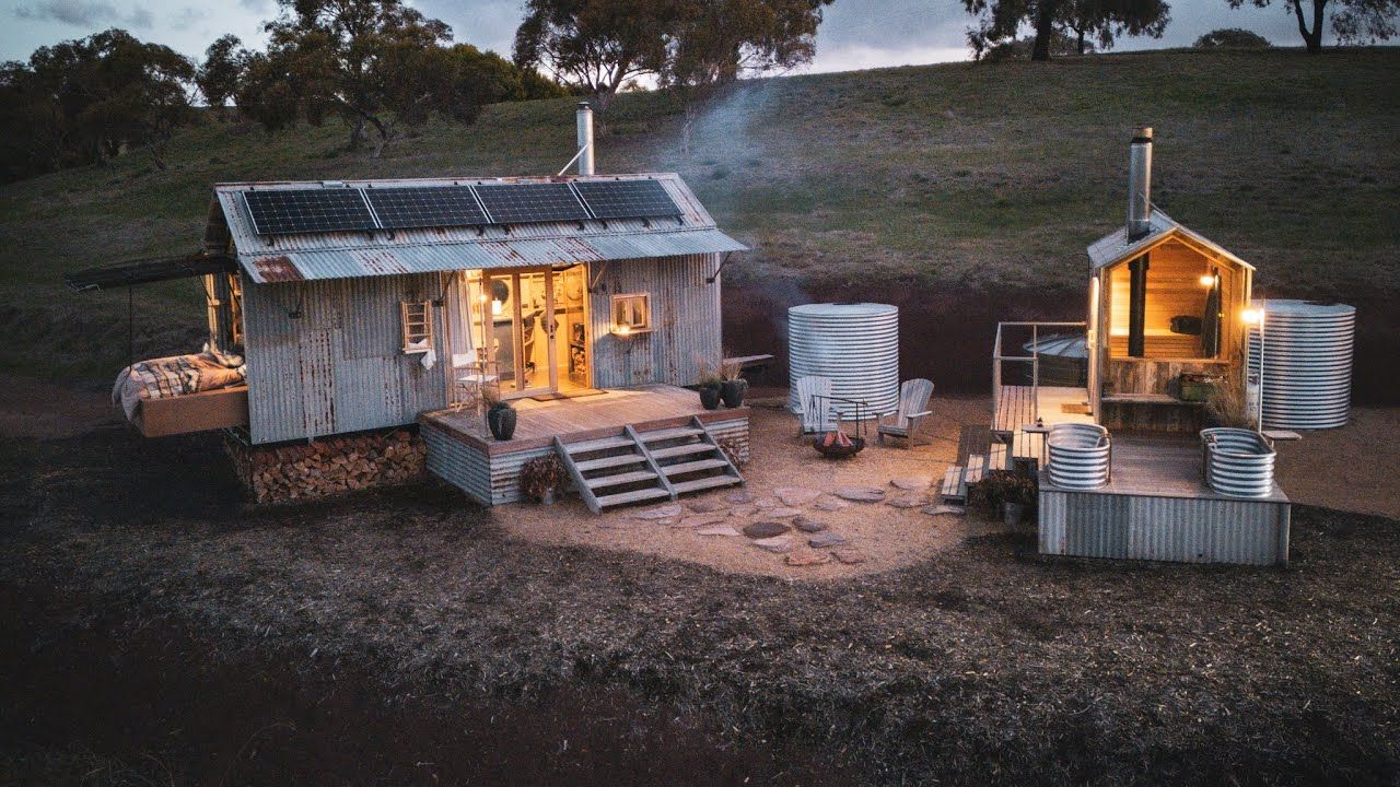  Inside An Upcycled Off-Grid Tiny Home with Roll-Out Sleeping Platform