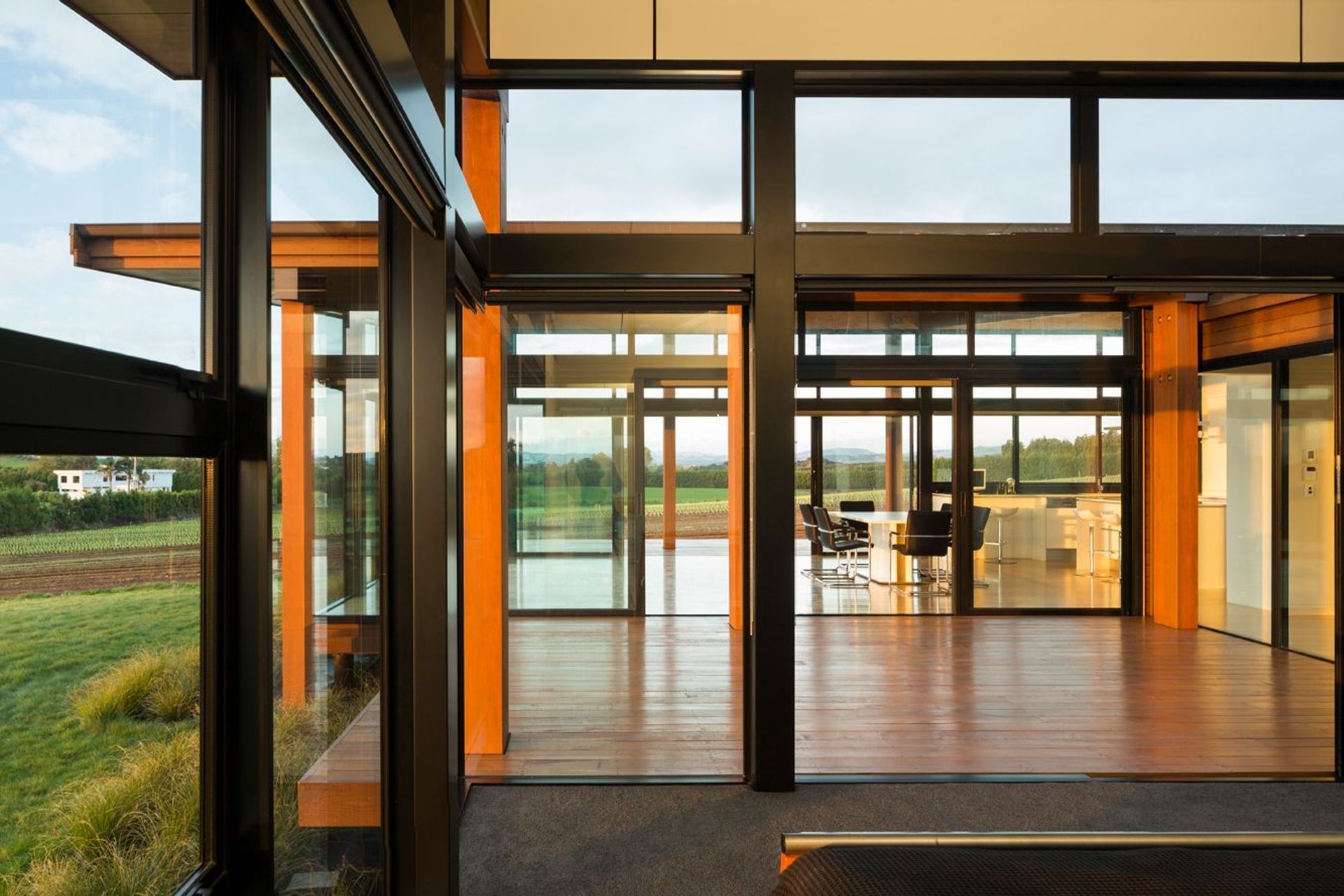 Extensive glazing encourages expansive views over the surrounding farmland.