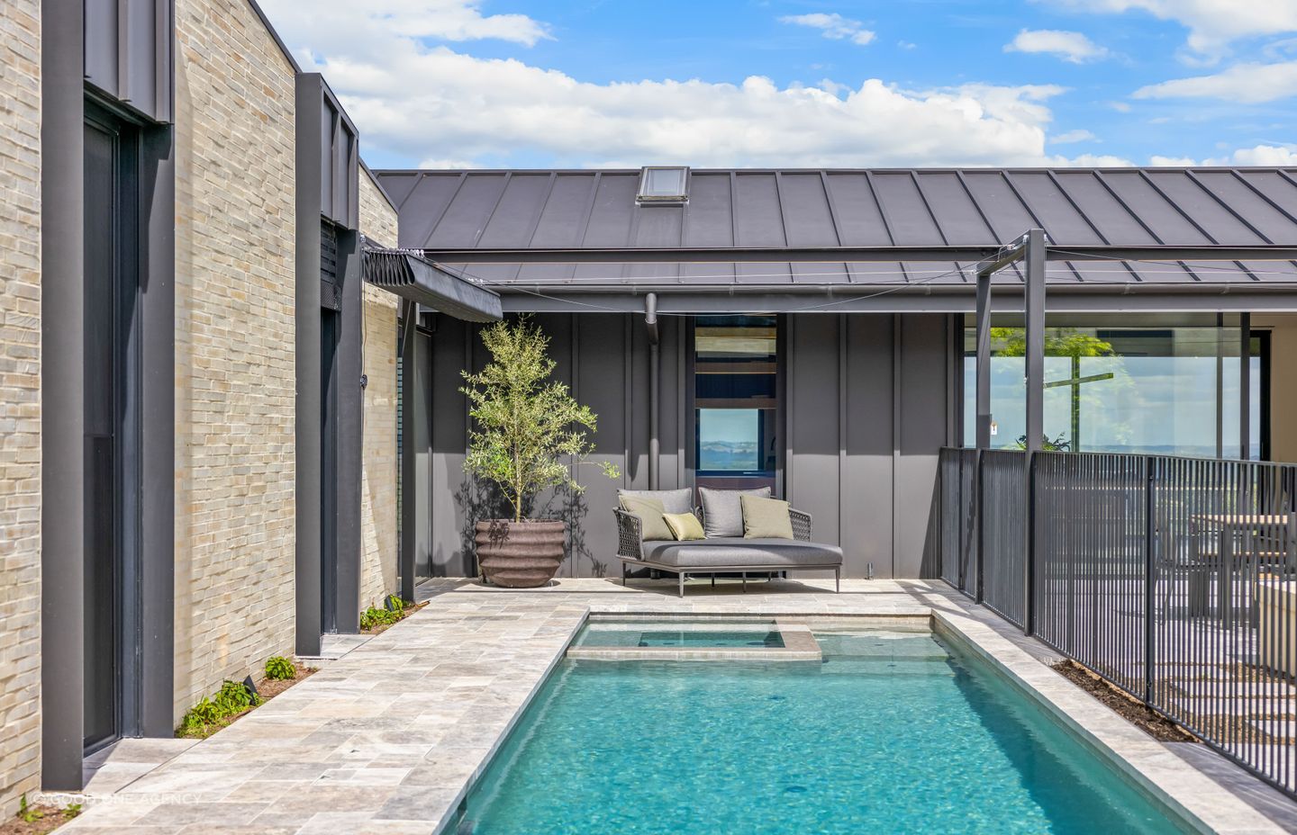 An enticing pool sits to side of the central courtyard