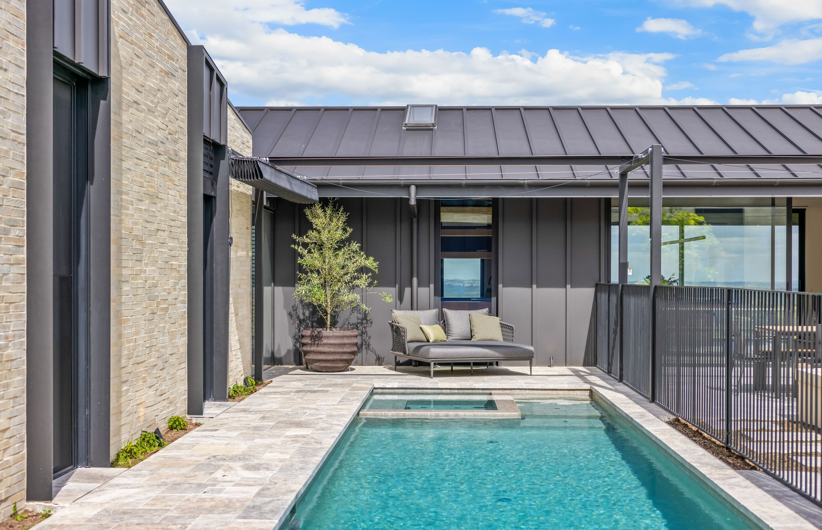 An enticing pool sits to side of the central courtyard