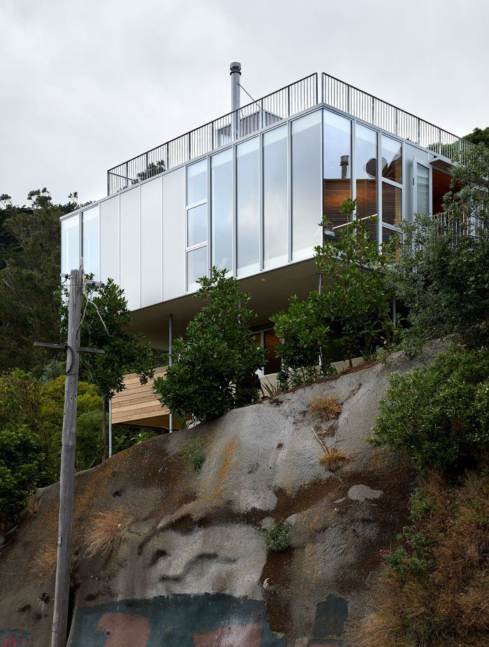Patchwork Architecture's 100m² 10x10 House is supported on steel poles, with killer views of Wellington city. Photograph by Simon Wilson.