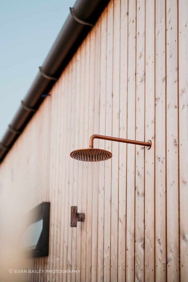 Siberian larch timber cladding, fixed with over 4000 hand-driven copper nails surrounds the residence.