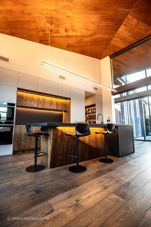 High ceilings clad in cedar create a visually striking and spacious interior.