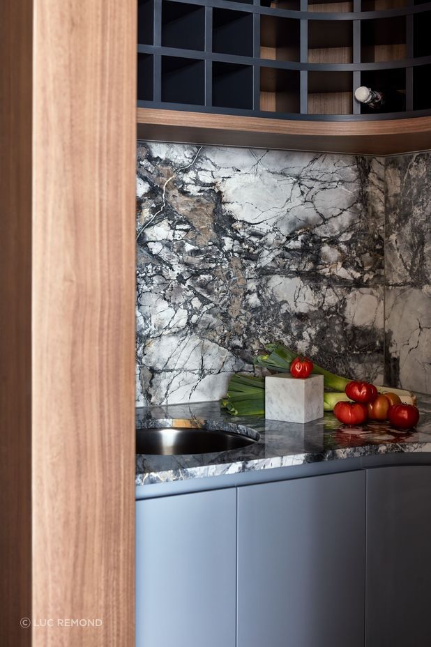 Blue-toned marble and walnut veneer suit the waterfront setting.