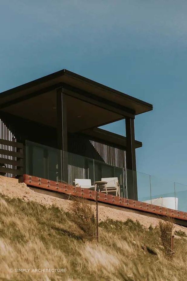 The 'Seafield' project boasts a dark exterior made of corrugated iron cladding, creating a showstopper guest home for their client.