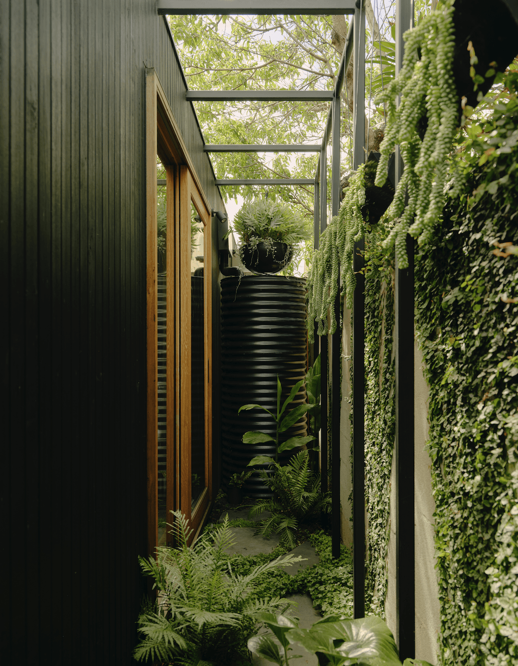 The striking project combines a whitewashed heritage terrace with a slick black extension to incredible monochromatic effect.