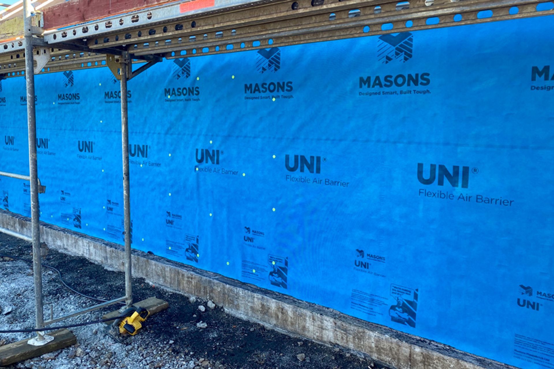 UNI FR is a flexible air barrier with unique reinforcing and water-resistant features that allows work to continue on the inside of the building for up to 90-days, without waiting for the cladding to be complete.