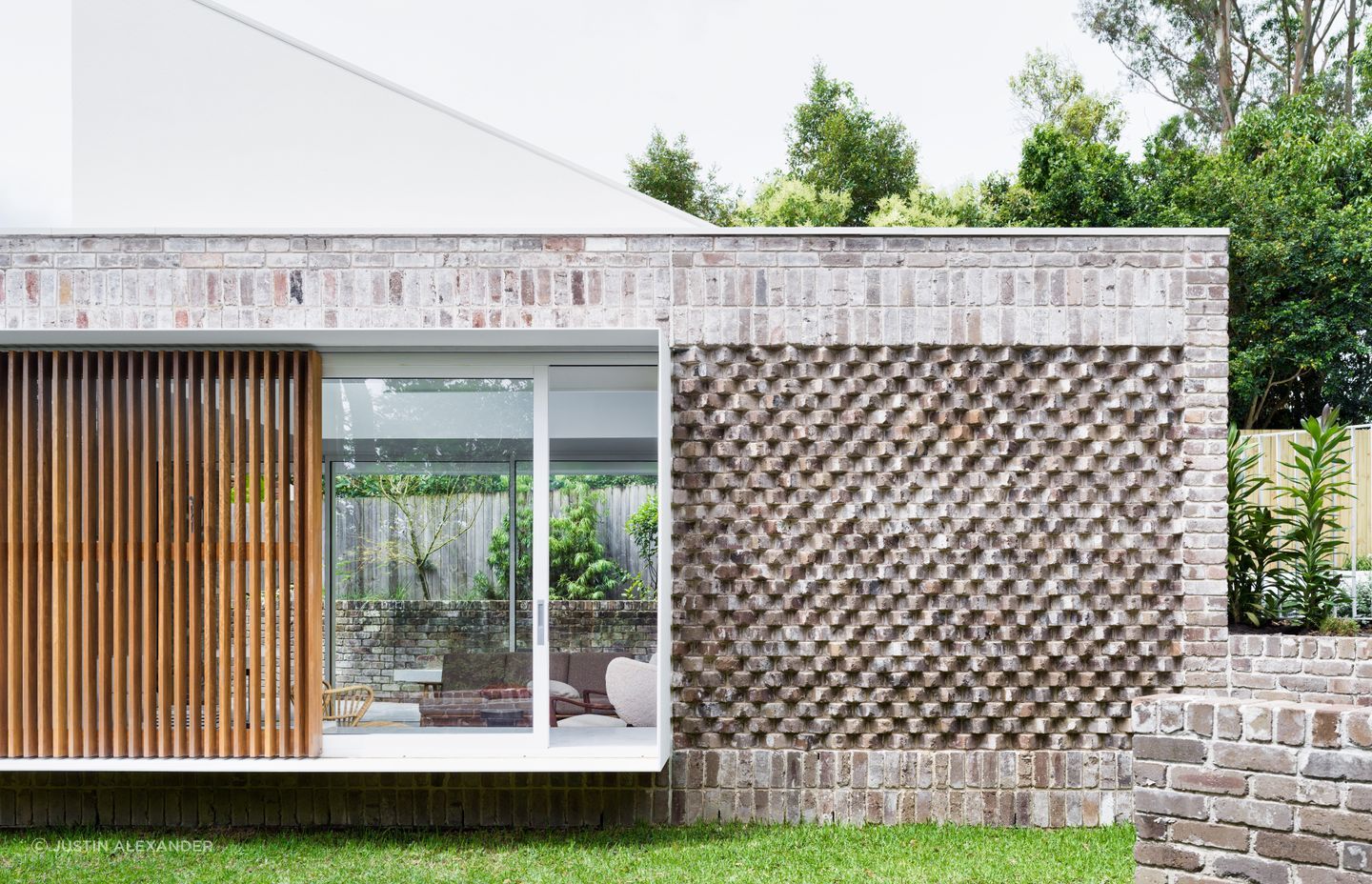 Recycled bricks laid in various bonds add interest to the exterior.