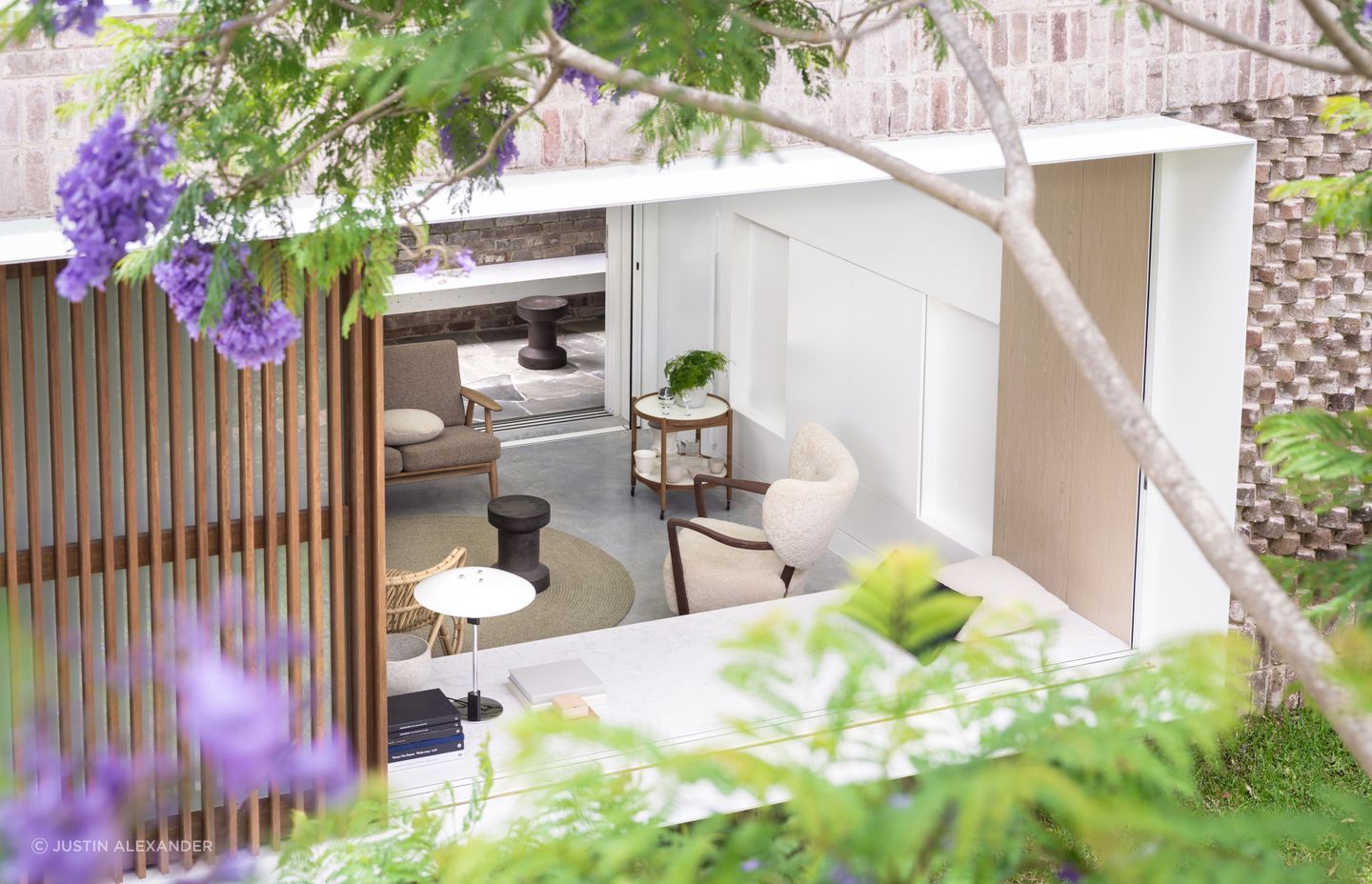 The home opens up to connect with the shared garden.