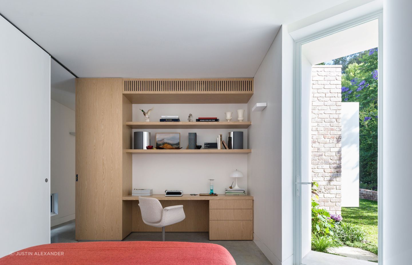 The bedroom doubles as a work from home space.