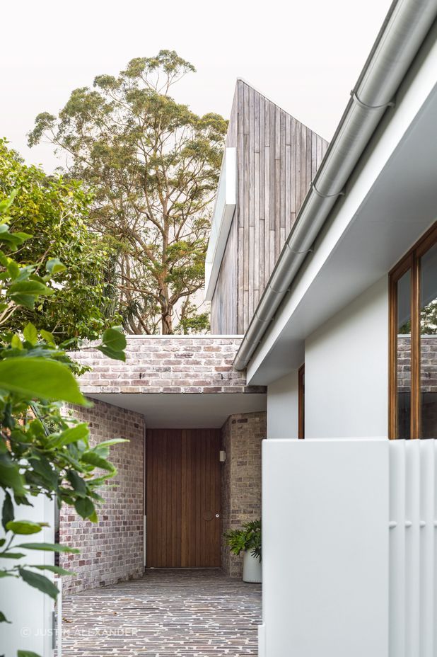The dwelling has its own entrance via a canopy of brick work.