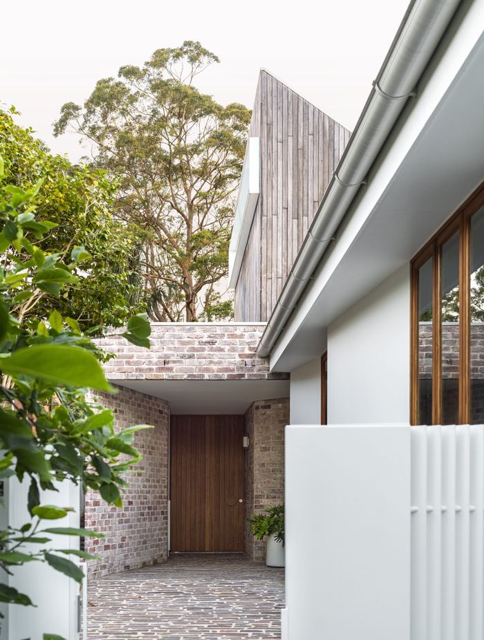 The dwelling has its own entrance via a canopy of brick work.