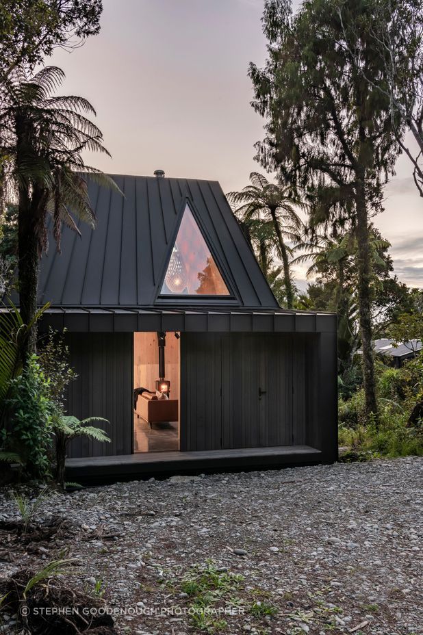 The triangular skylight offers views to the the cliff face above.