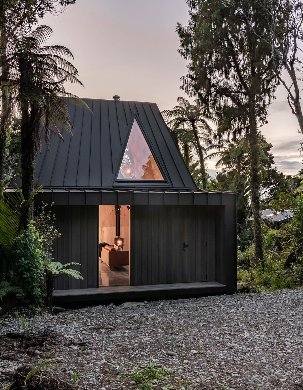 The triangular skylight offers views to the the cliff face above.