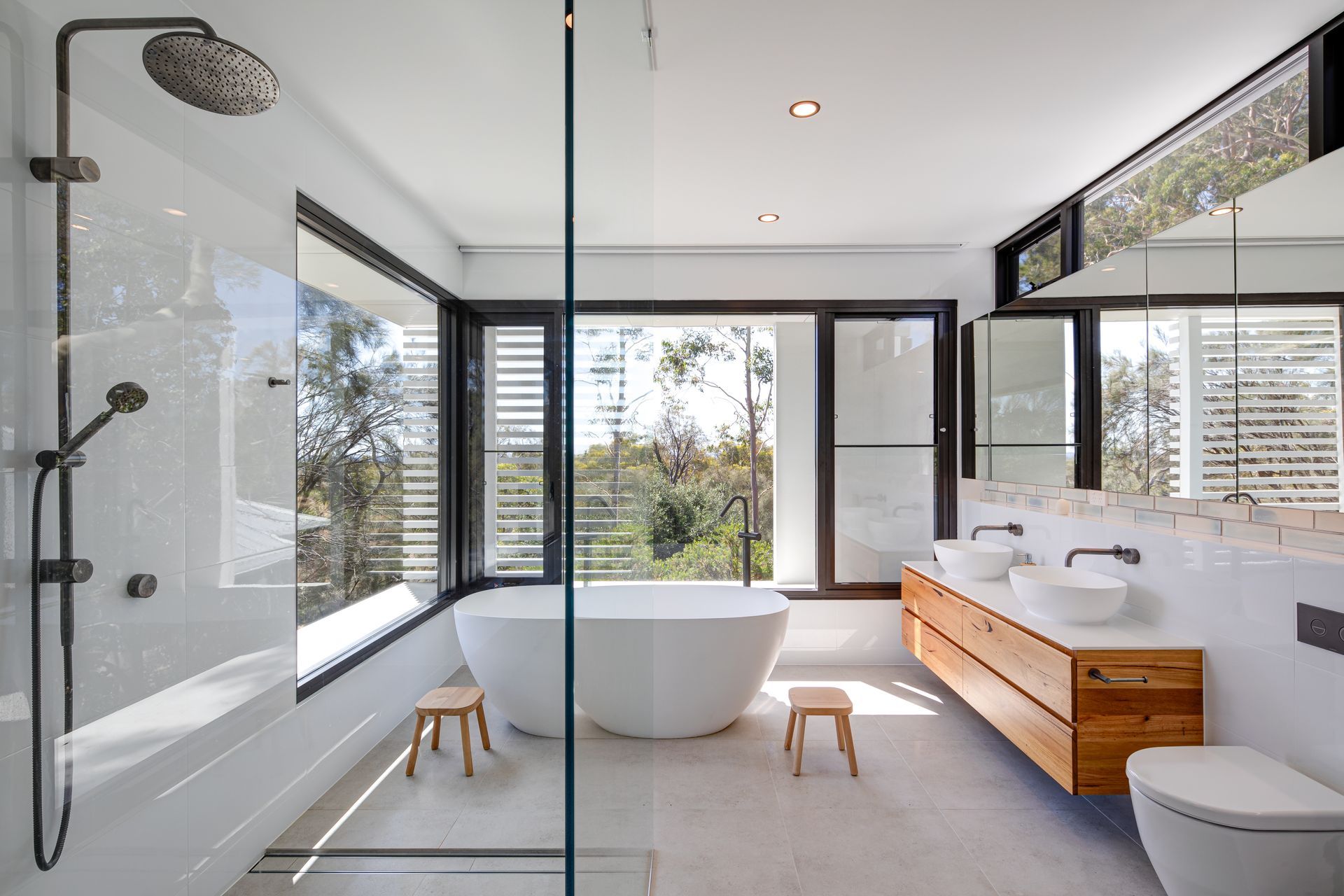 The homeowners wanted a treehouse-like extension that worked as its own separate space from the home, to be used as guest accommodation for extended family and an easygoing space for the kids to have their nightly bathroom ritual.