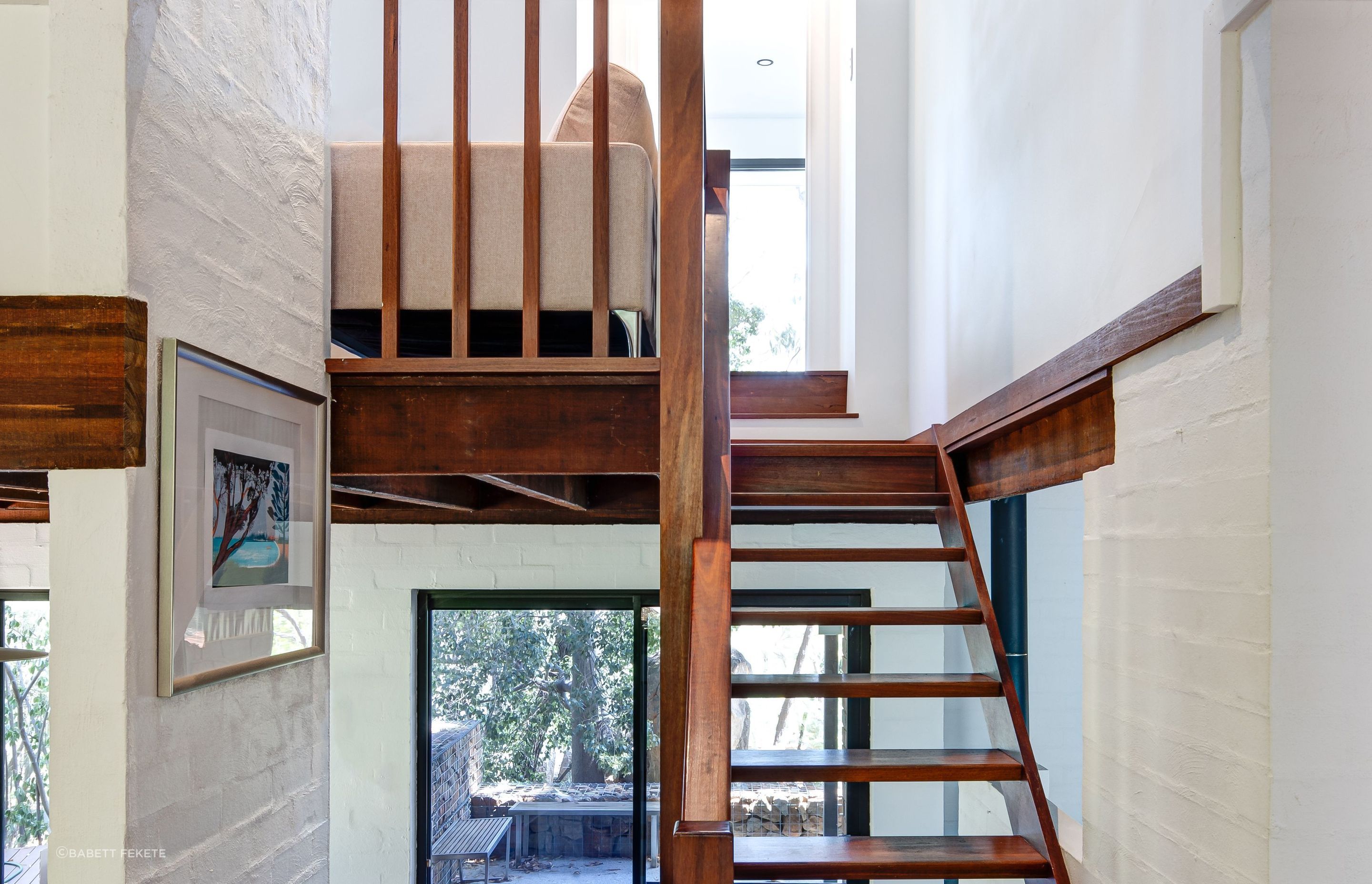 A seamless connection is created between the space and the existing upper floor through the original jarrah staircase.