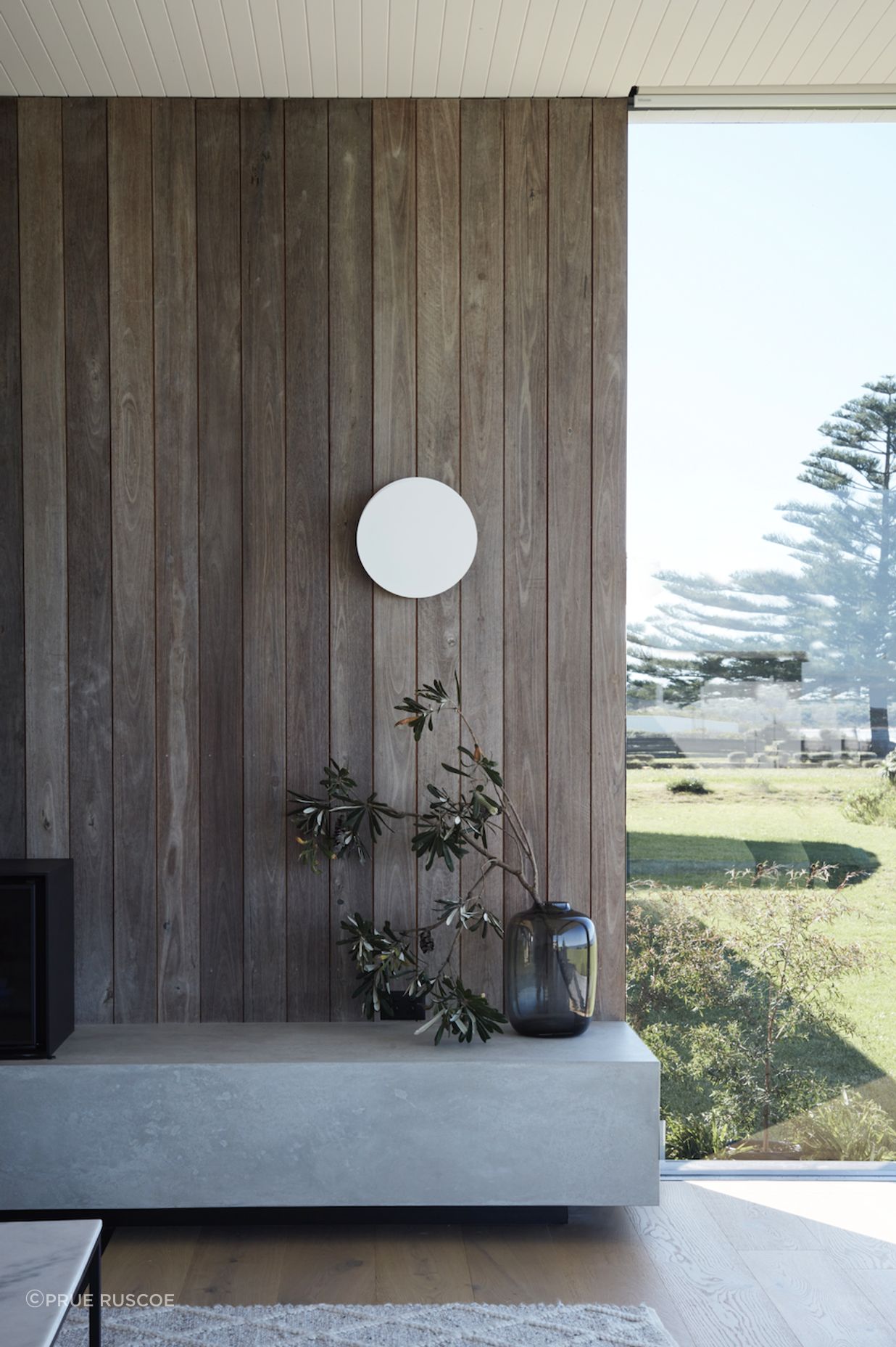 The home's weathered texture echoes the Australian landscape's inherent longevity and resilience.