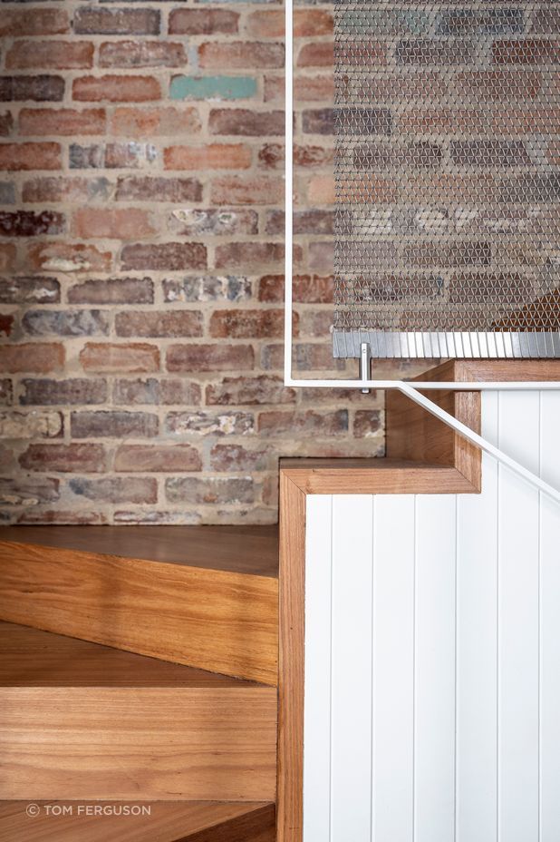 A unique metal curtain addressed both the handrail and lighting issues upstairs.