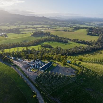 A residence carved into the hillside, crafted to embrace the sweeping vistas of the Yarra Valley.