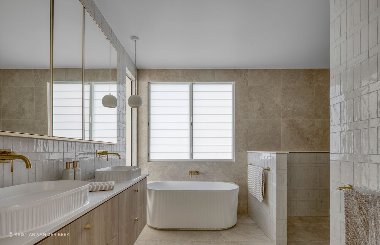 The ensuite, a true sanctuary, captivates with a beautiful mix of textures | Habitat Studio Architects