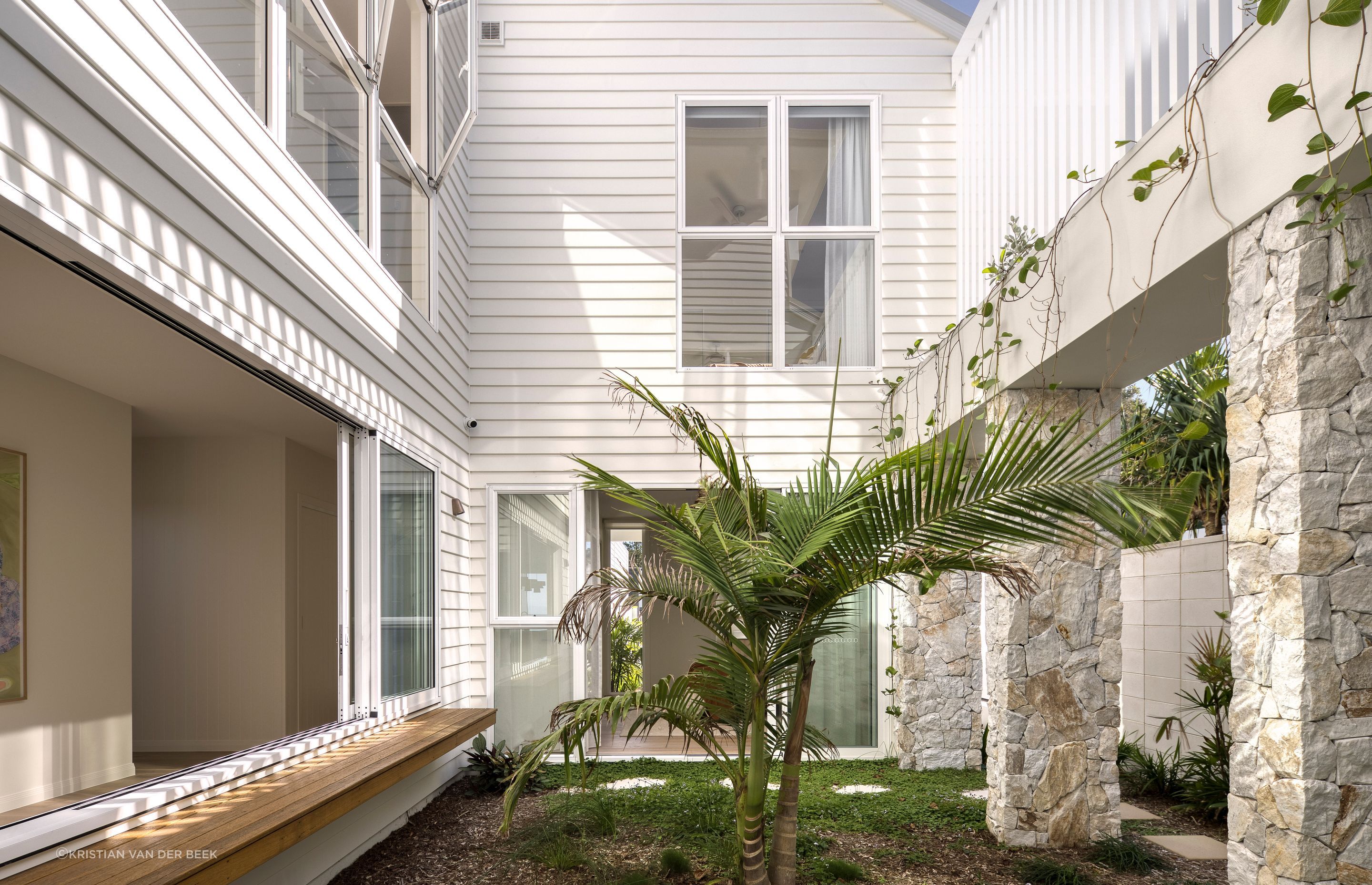 The central courtyard infuses the home with light and connects all ground floor spaces with nature | Habitat Studio Architects