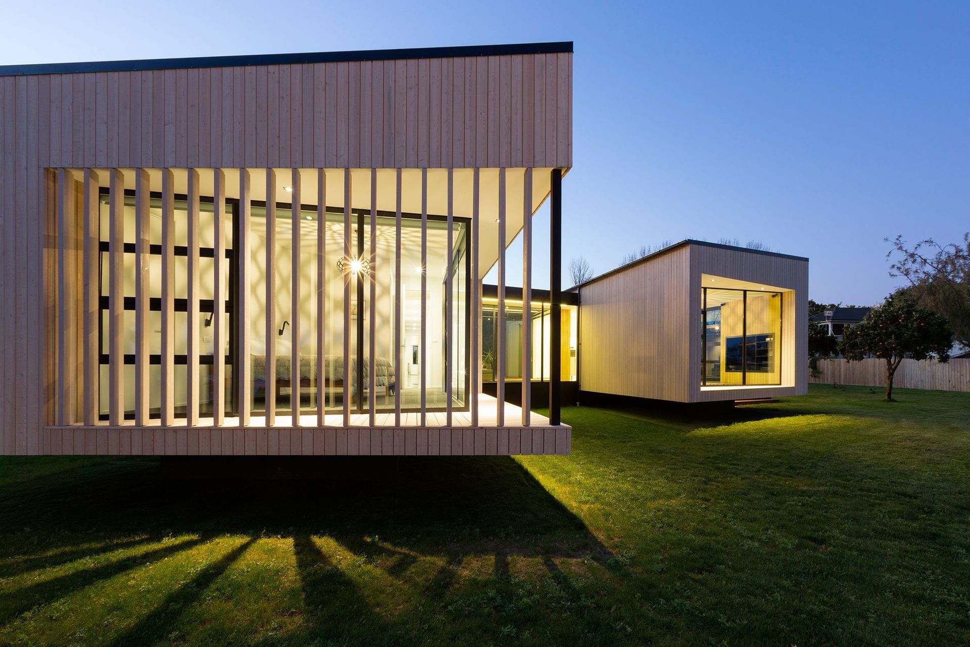 Noel Jessop Architects' Floating Boxes are two interconnected boxes that appear to hover off the ground, cleverly angled to take in the local mountain view. Photograph by Amanda Aitken Photography.