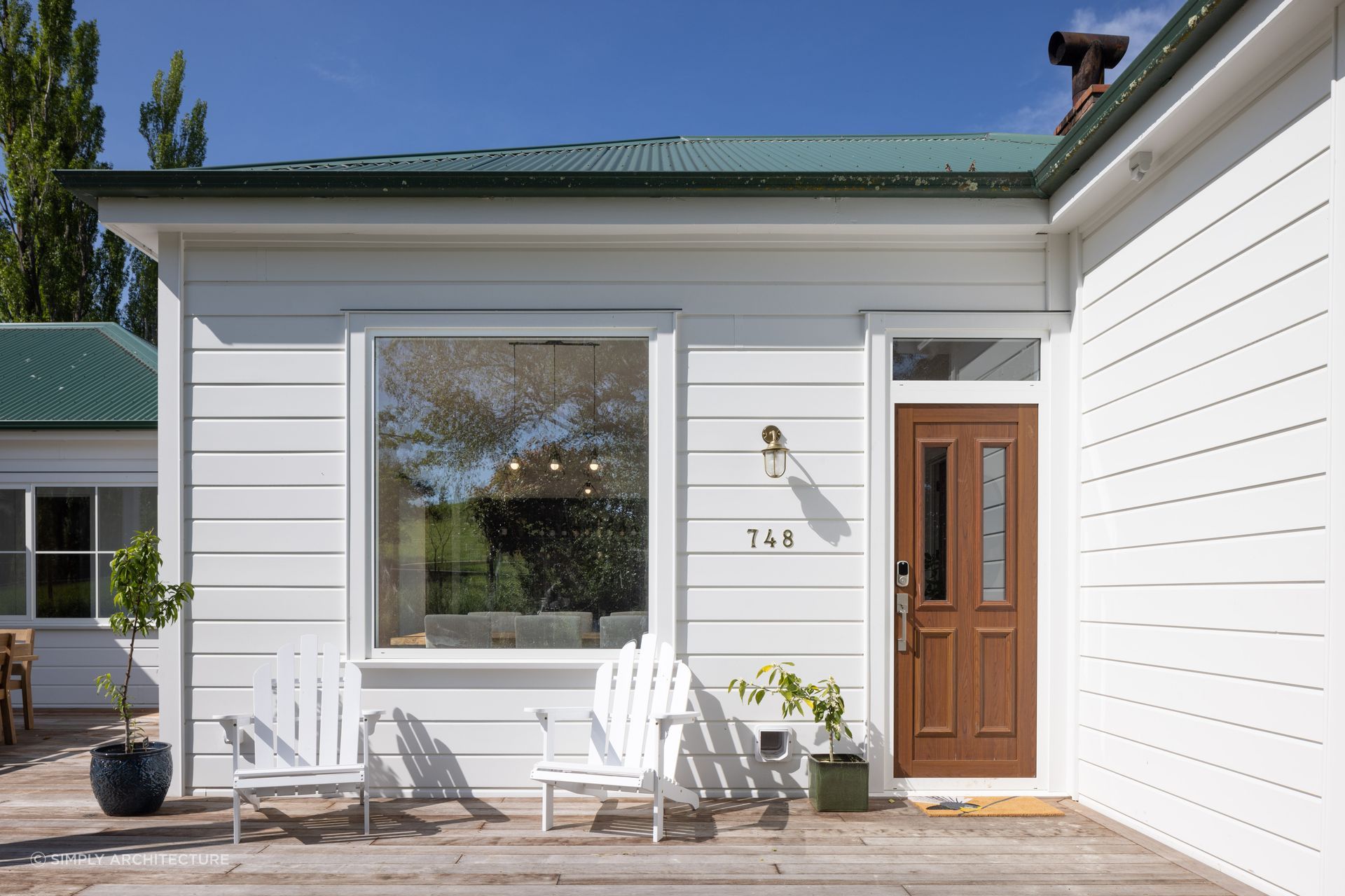 The 'Taihape Extension' by Simply Architecture saw a preservation of the home's farm-like aesthetic, whilst opening up the kitchen and living room, and adding a master suite and new bedroom.