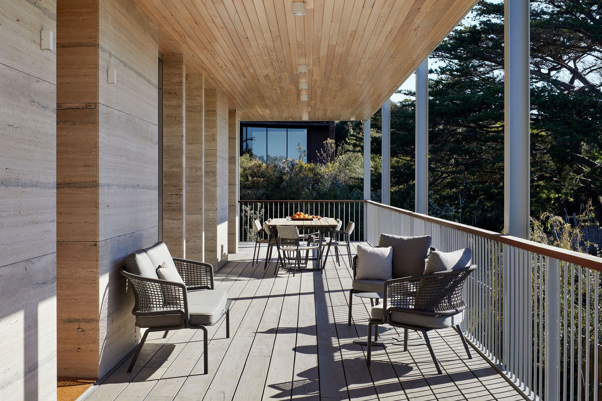 The large patio wraps the house, offering views of the dunes.