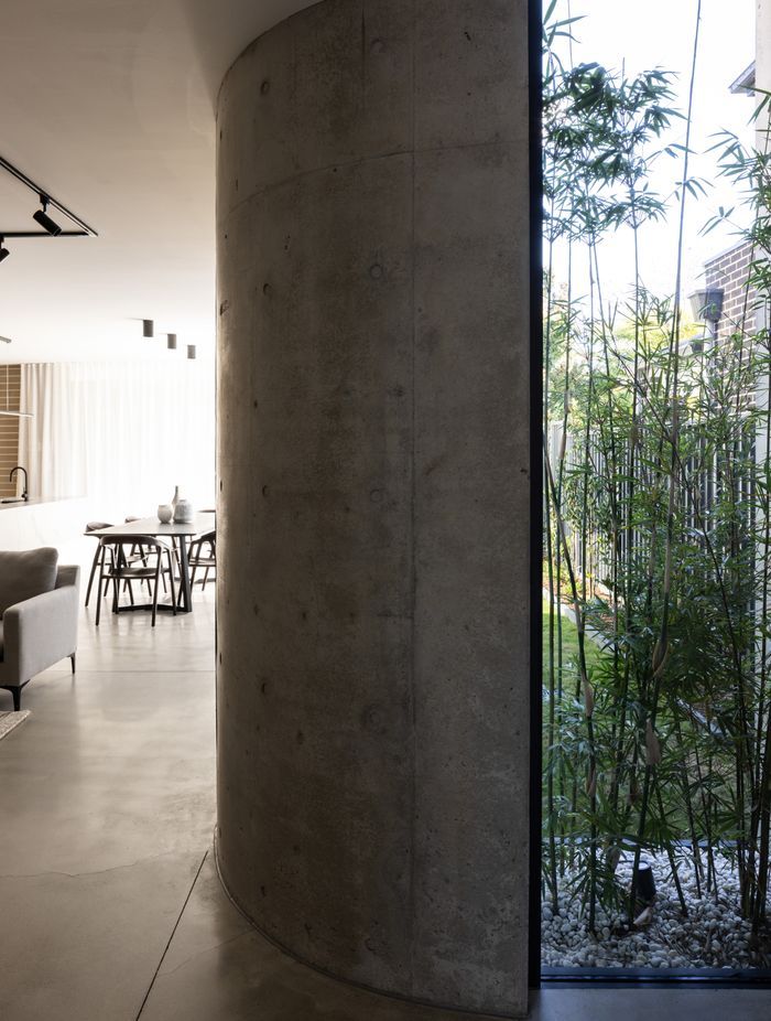 Severe materials curving softly.